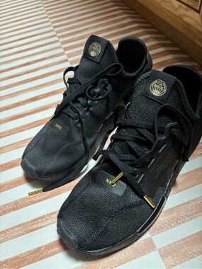 adidas Black Men’s NMD_R1 Sneakers with Gold Accents